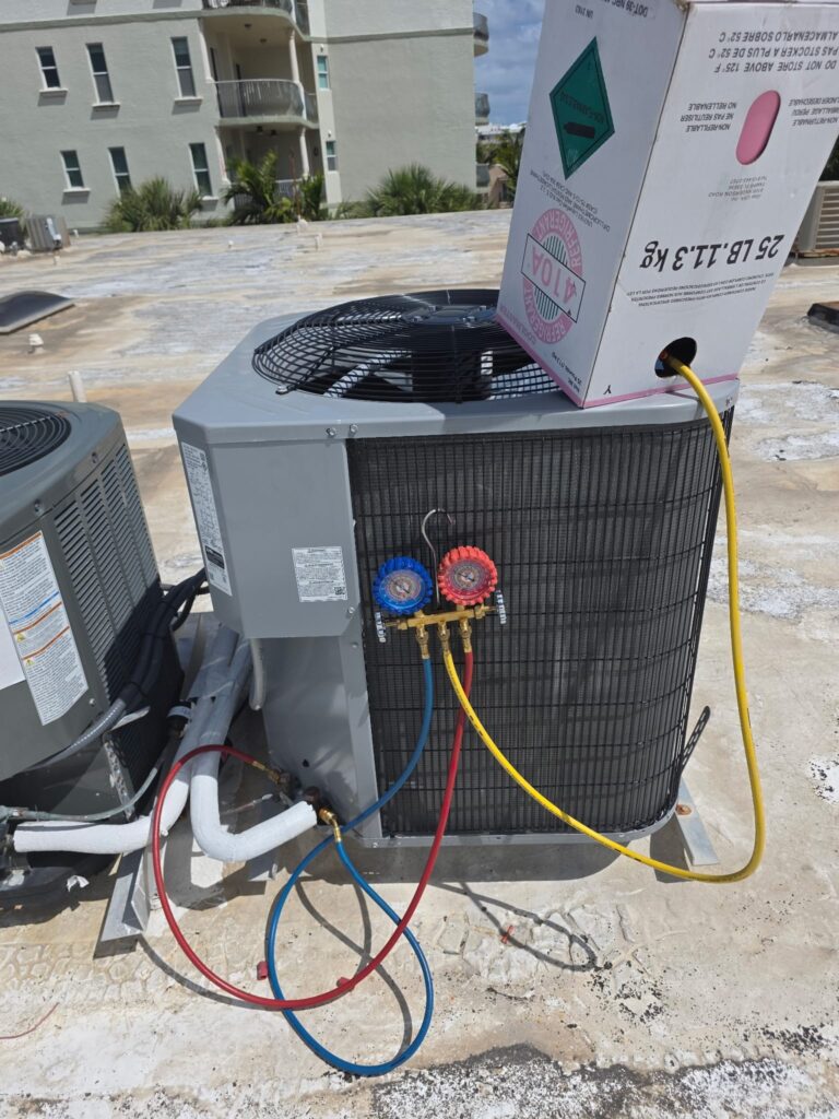 Professional AC repair in Boca Raton showing an outdoor air conditioning unit being serviced